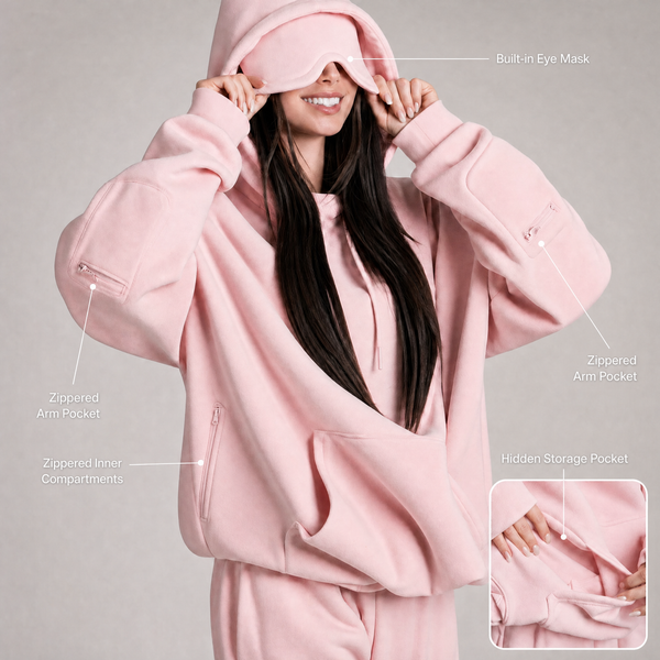 Hoodie modo avión rosa con el antifaz incorporado en la capucha y los bolsillos señalados